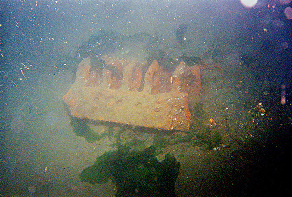 An old engine block used fro secondary anchor, cement block in foreground is maini anchor tieup.